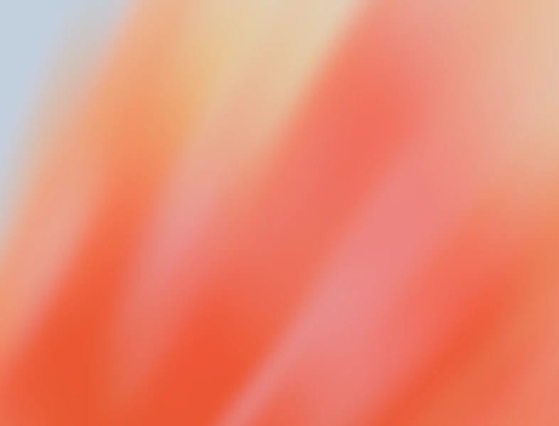 Abstract red, orange, and pink gradient background.