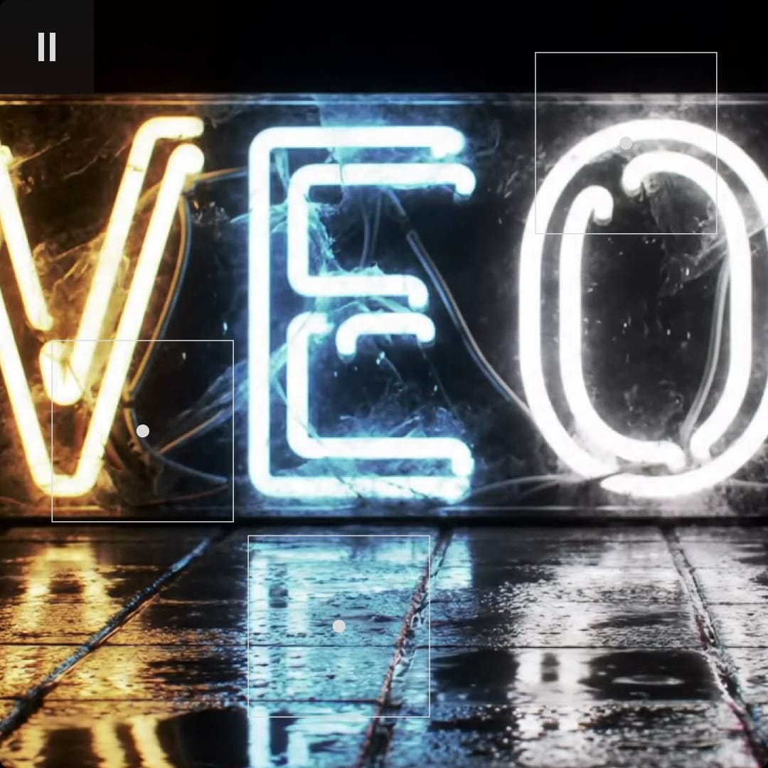 Neon sign spelling "VET" with reflections on a wet surface.