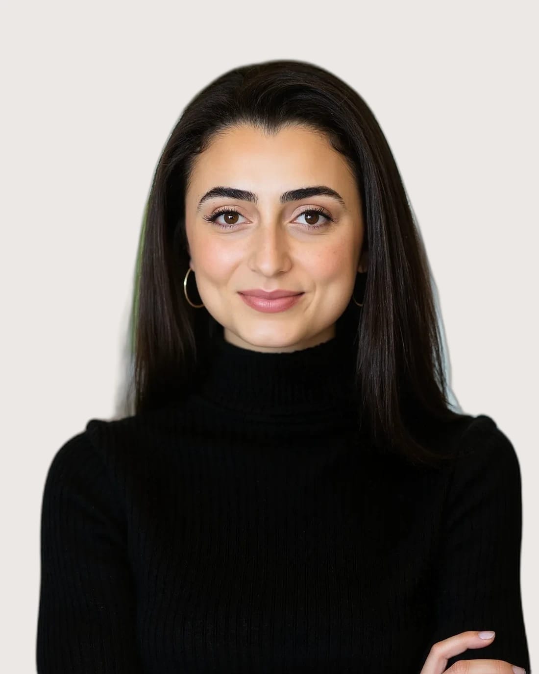 Professional headshot of a woman with long dark hair wearing a black turtleneck.